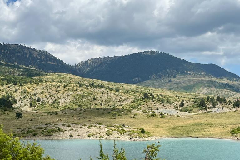 Turquoise mountain lake in the green highlands of Epirus
